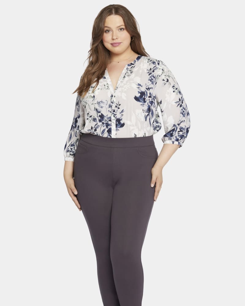 Front of a model wearing a size 0X Andrea Modern Legging in Cordovan by NYDJ. | dia_product_style_image_id:301536
